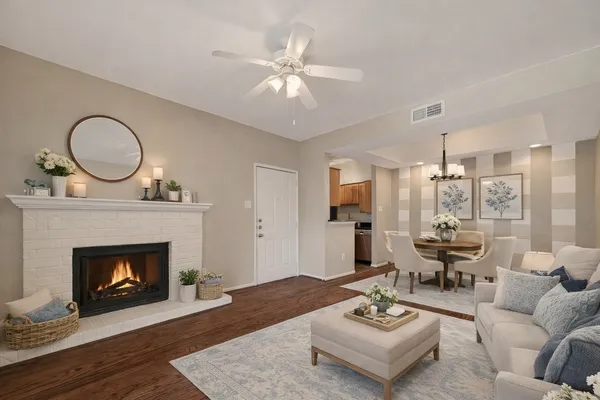 a living room with furniture and a fireplace