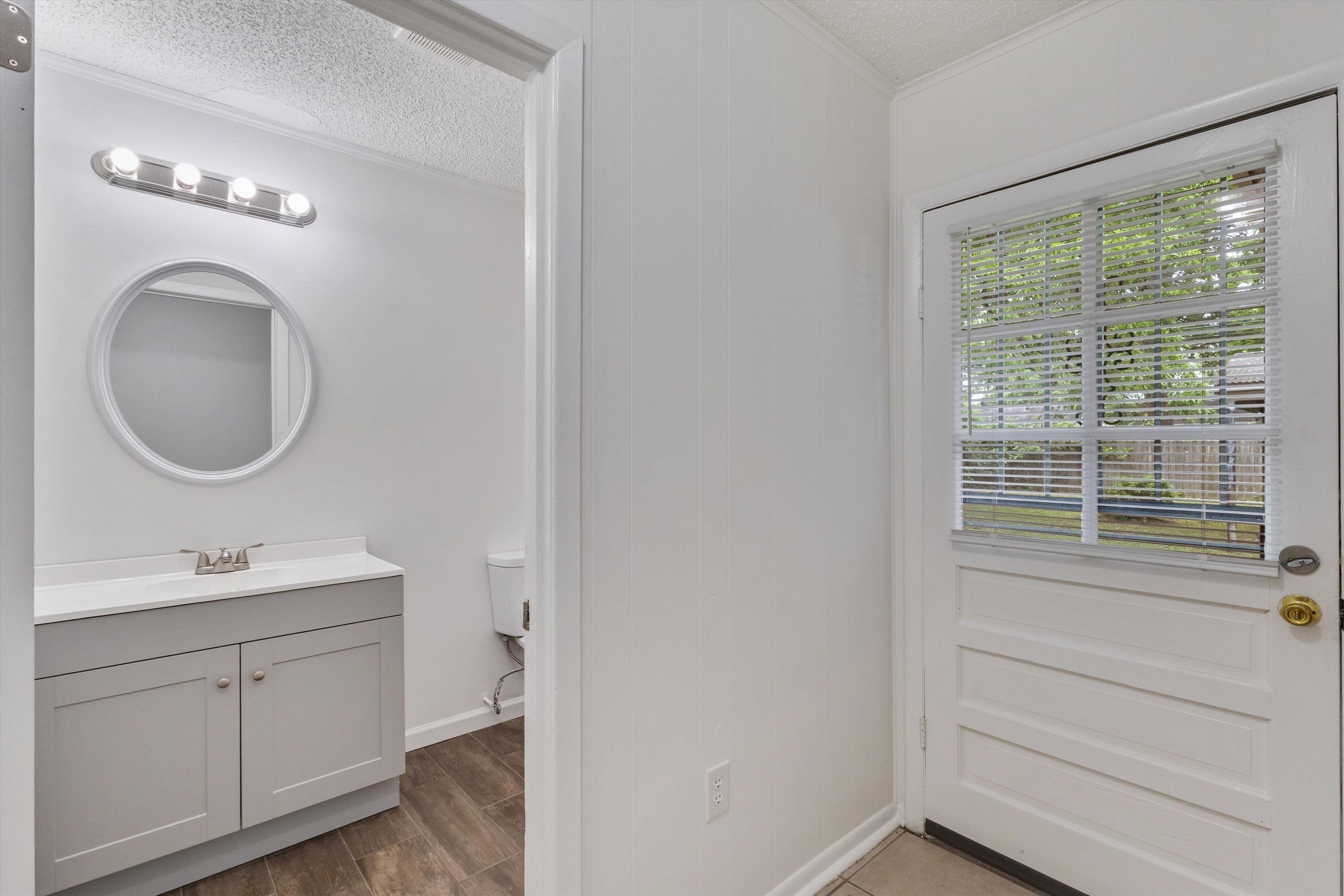 4565 Verne Road Memphis, TN 38117 - Photo 10 of 18 Bathroom entry featuring a white paneled door with a privacy glass inset