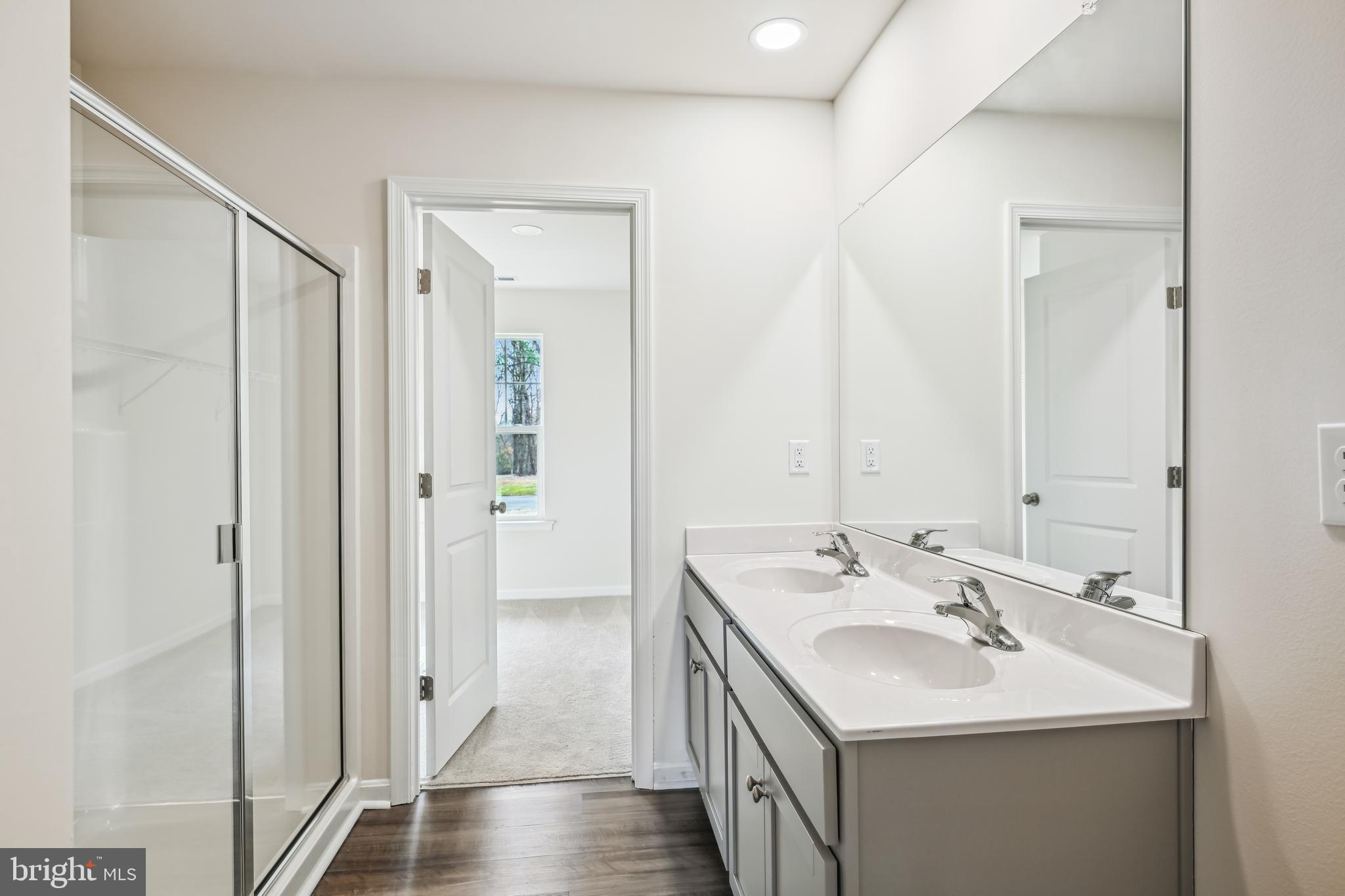 11235 Lord Baltimore Drive Issue, MD 20645 - Photo 17 of 23 a bathroom with a sink and a mirror