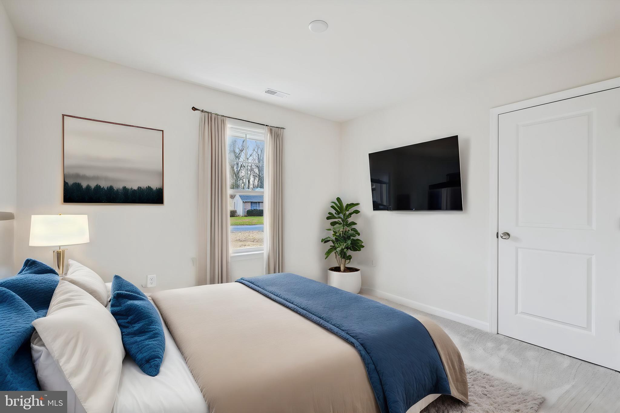 11235 Lord Baltimore Drive Issue, MD 20645 - Photo 22 of 23 a bedroom with a bed and a flat screen tv