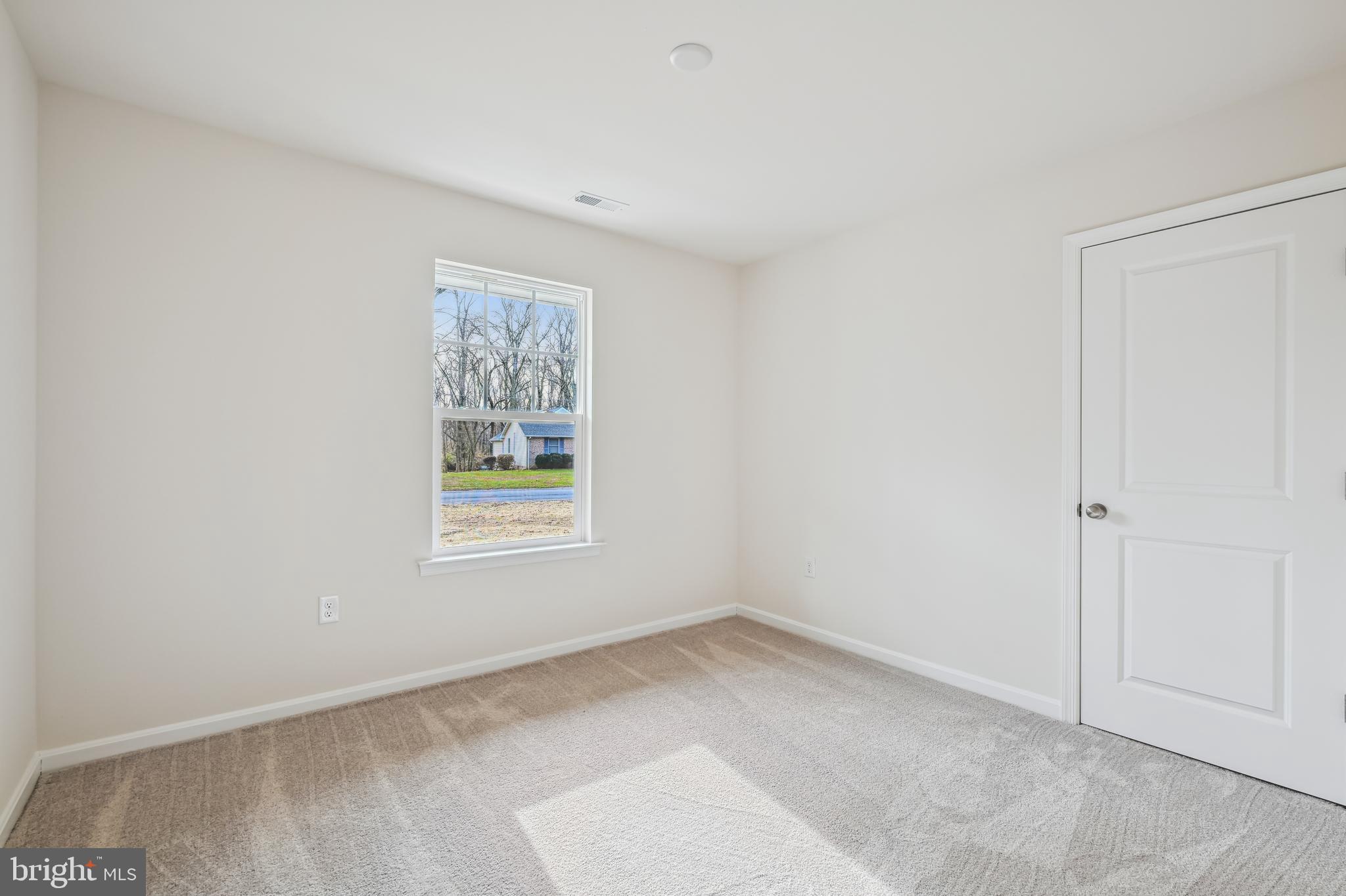 11235 Lord Baltimore Drive Issue, MD 20645 - Photo 4 of 23 a view of an empty room with a window