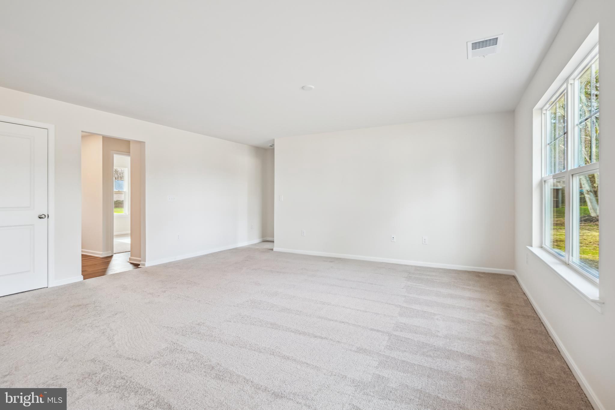 11235 Lord Baltimore Drive Issue, MD 20645 - Photo 9 of 23 a view of an empty room with a window