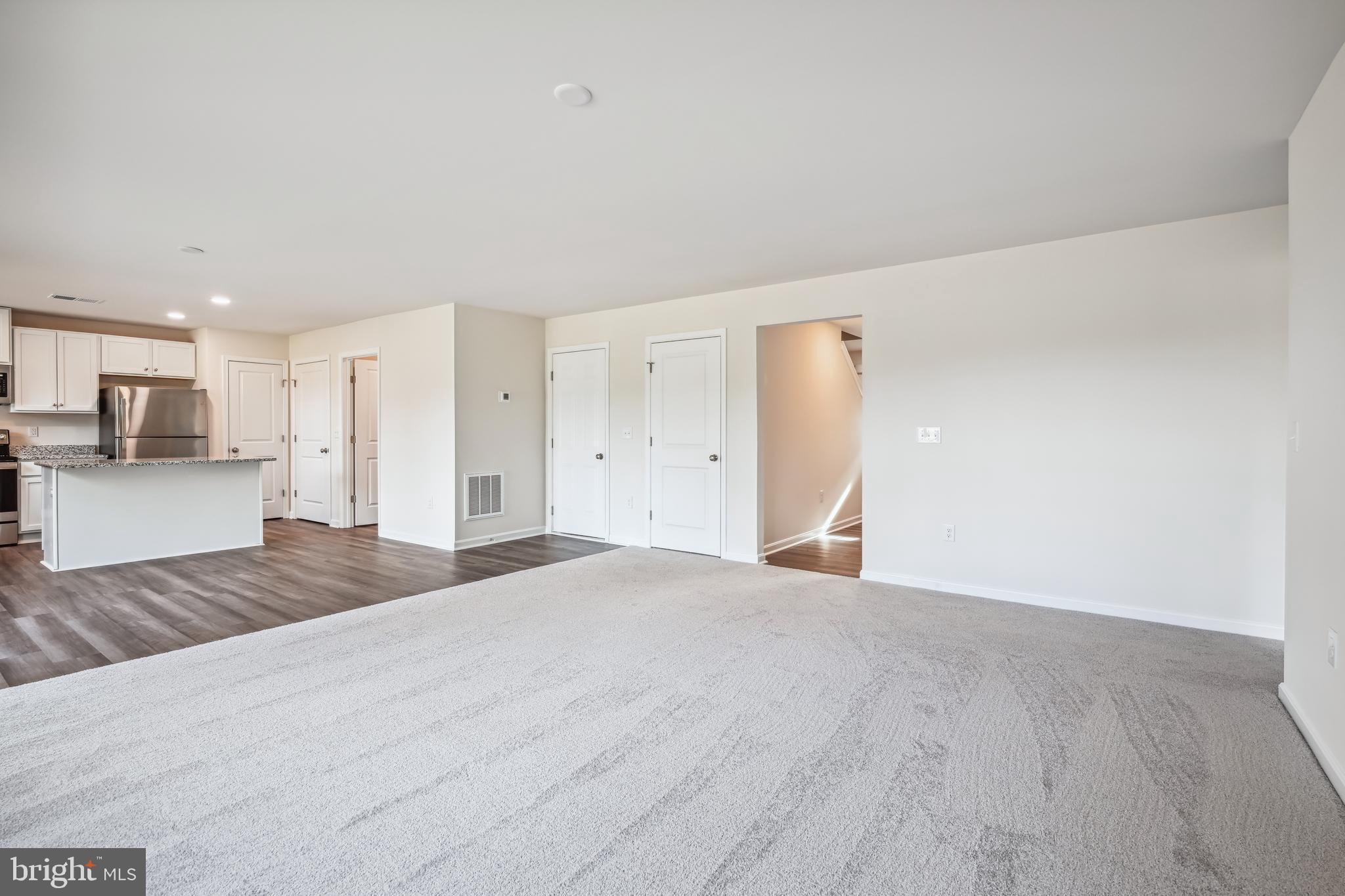 11235 Lord Baltimore Drive Issue, MD 20645 - Photo 10 of 23 a view of a kitchen with a sink and a refrigerator