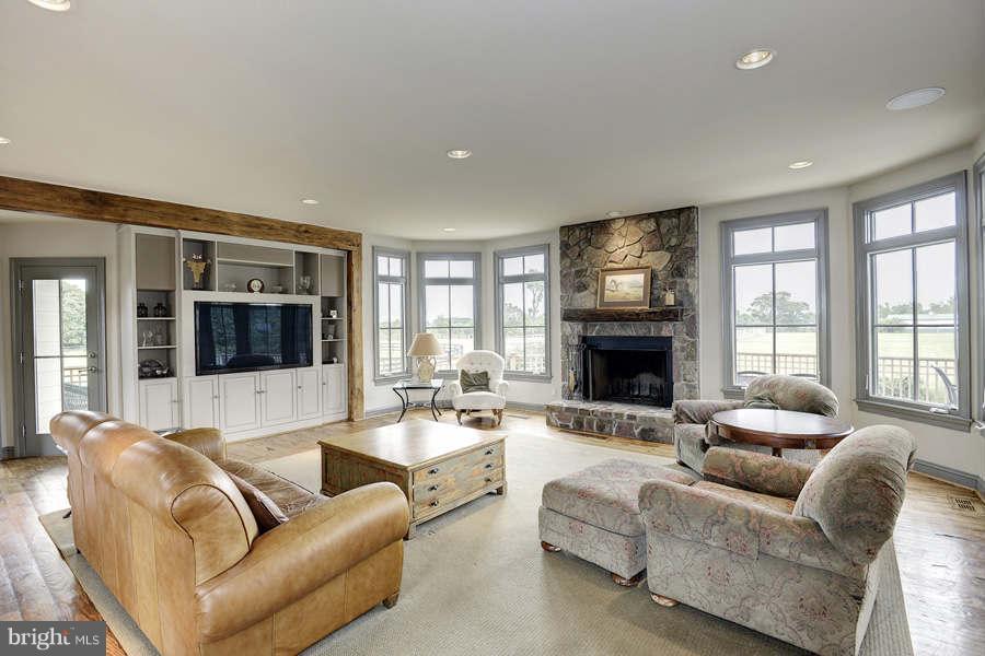 14527 Partnership Road Poolesville, MD 20837 - Photo 13 of 30 a living room with furniture flat screen tv and a large window