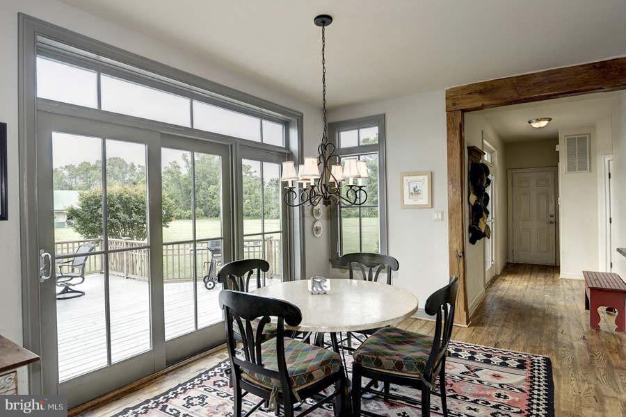 14527 Partnership Road Poolesville, MD 20837 - Photo 17 of 30 a view of a dining room with furniture window and wooden floor