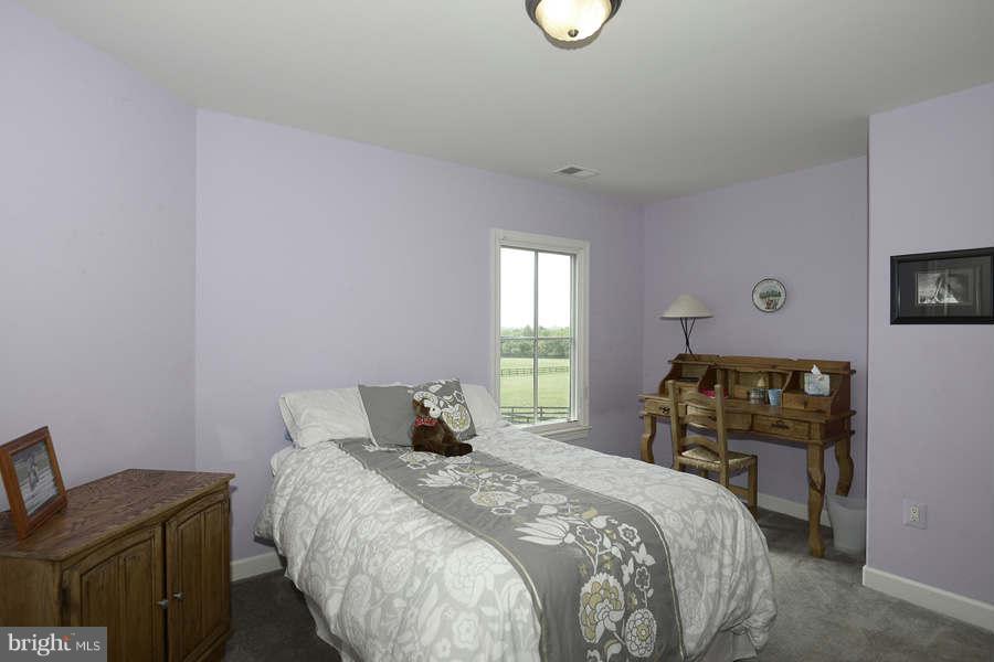 14527 Partnership Road Poolesville, MD 20837 - Photo 22 of 30 a bedroom with a bed and window