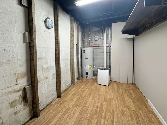 a bathroom with a shower and a sink