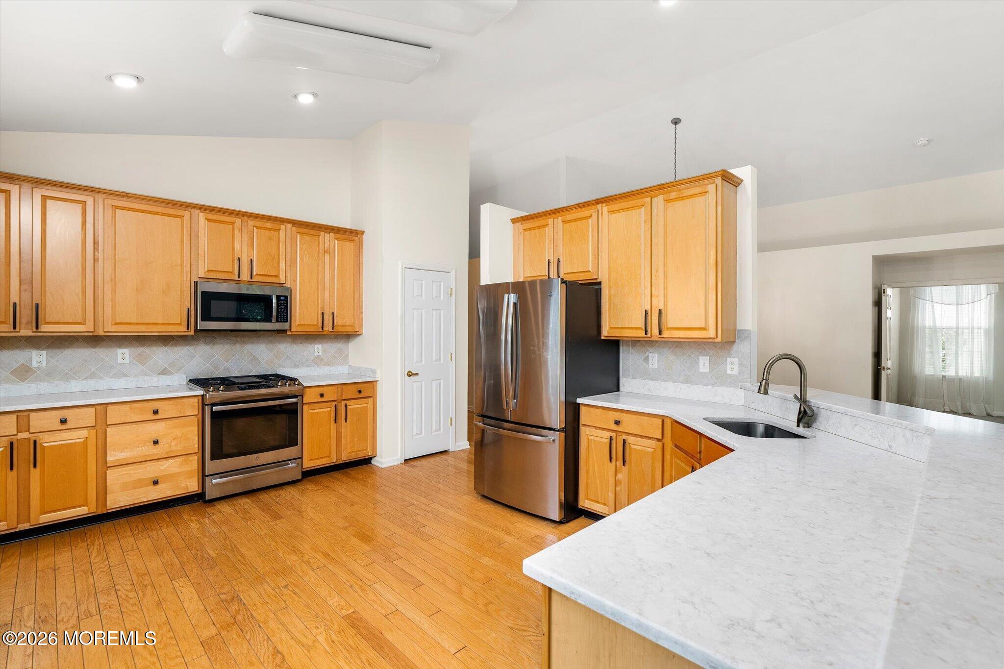 10 Powderhorn Way Allentown, NJ 08501 - Photo 11 of 27 a kitchen with stainless steel appliances granite countertop a sink stove and refrigerator