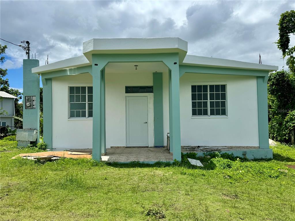 186 Bo Jimenez Km 25.1 Rio Grande, Río Grande 00745 - Photo 1 of 1 a front view of a house with garden