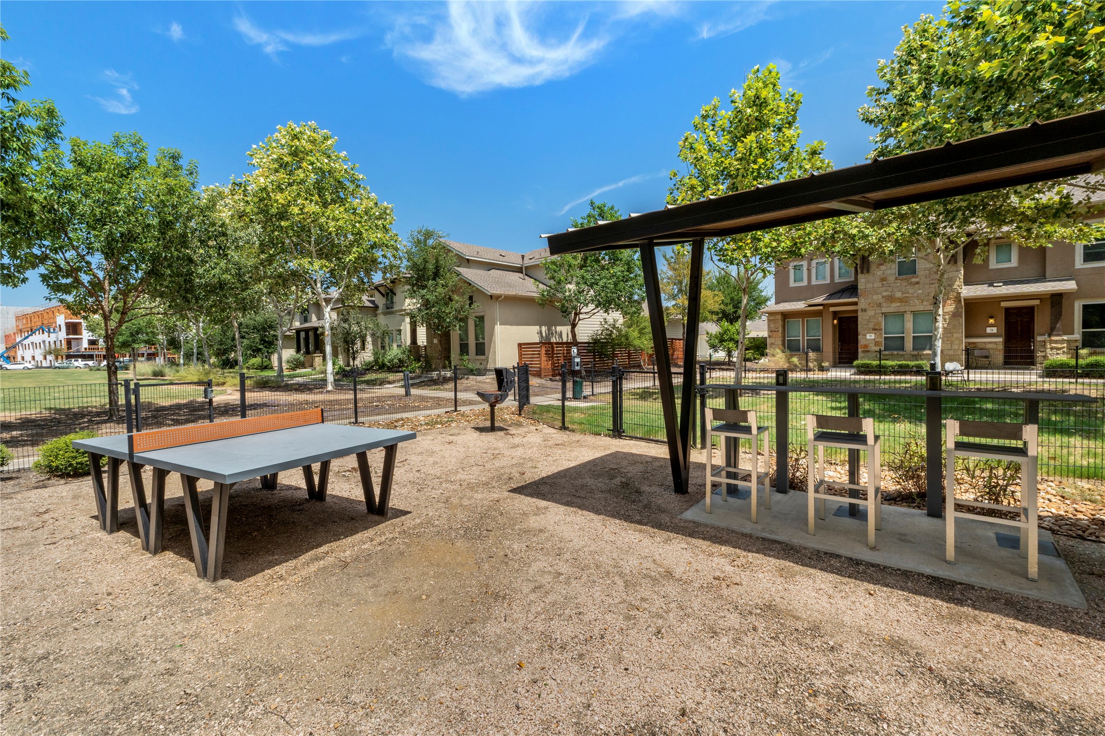 1709 Lawrence Street, Unit 5 Austin, TX 78741 - Photo 38 of 40 Shaded outdoor seating and recreation space sits adjacent to neighborhood residences.