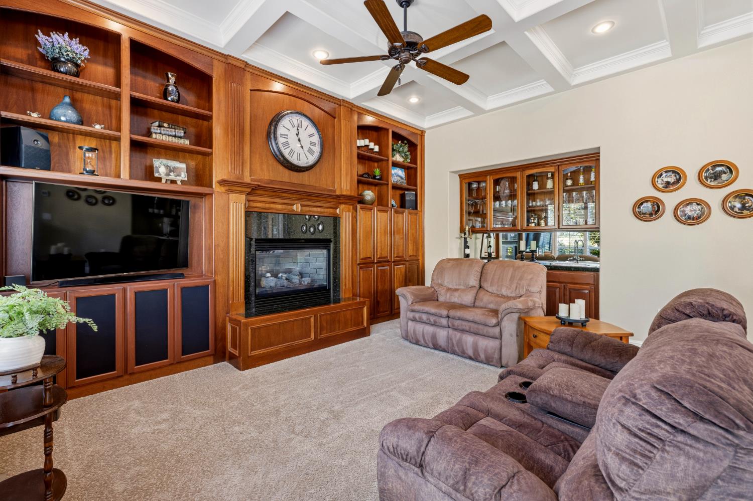 5869 Granite Hills Drive South Granite Bay, CA 95746 - Photo 16 of 66 a living room with furniture a flat screen tv and a fireplace