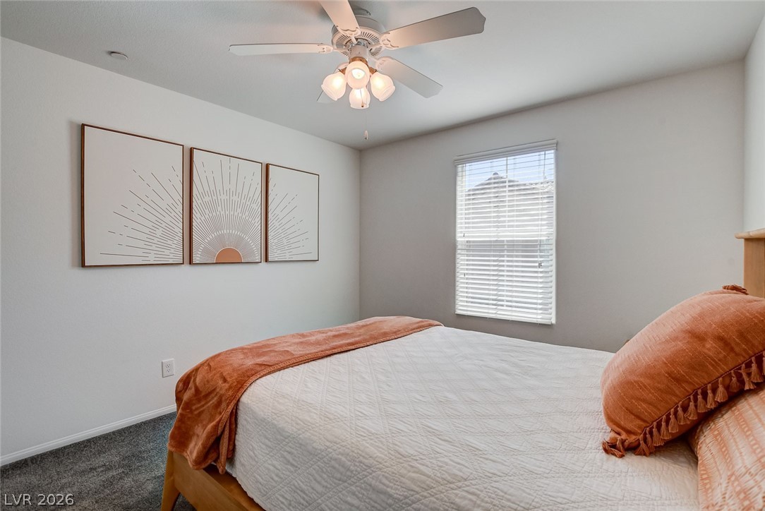 484 Filaree Place Henderson, NV 89015 - Photo 36 of 71 This inviting bedroom provides a comfortable retreat, featuring ample natural light and plush carpeting.