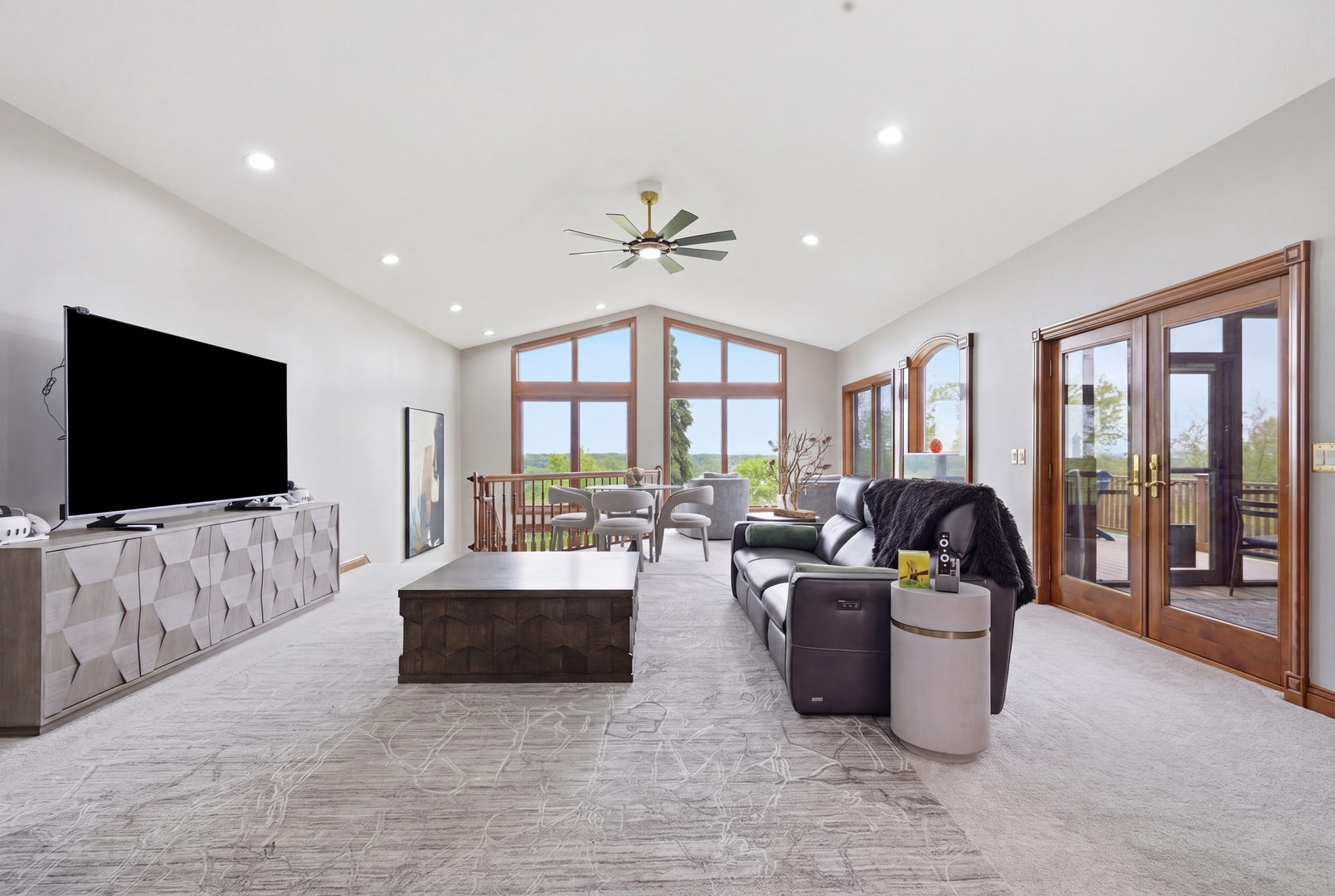 1009 Melody Hills Fulton, IL 61252 - Photo 15 of 51 a living room with furniture a flat screen tv and a large window
