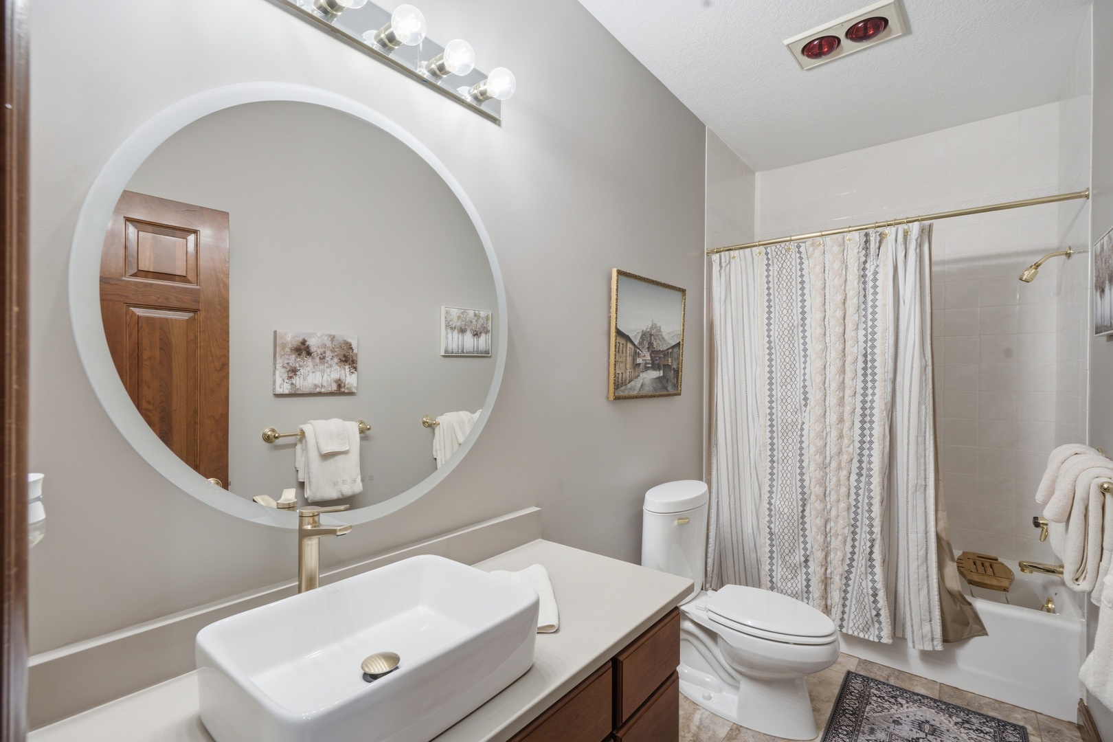 1009 Melody Hills Fulton, IL 61252 - Photo 27 of 51 a bathroom with a sink a mirror a toilet and a mirror