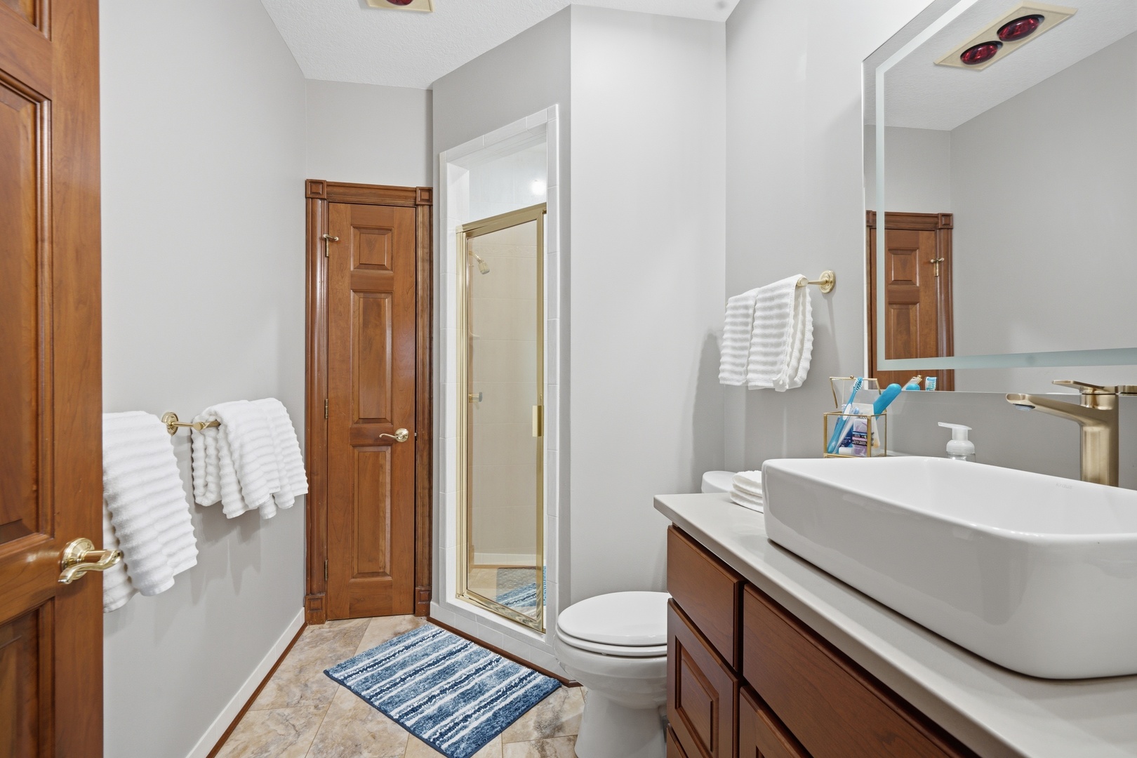 1009 Melody Hills Fulton, IL 61252 - Photo 40 of 51 a bathroom with a sink a toilet and shower