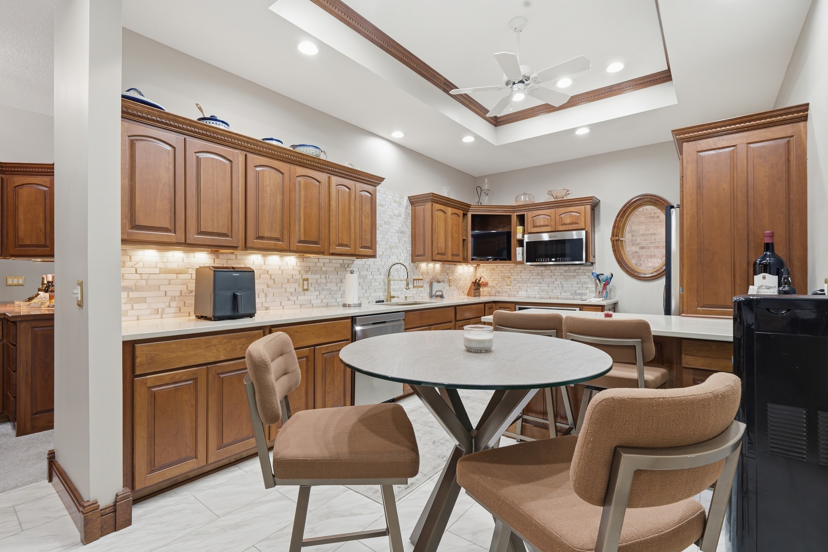 1009 Melody Hills Fulton, IL 61252 - Photo 10 of 51 a kitchen with a dining table chairs and a refrigerator