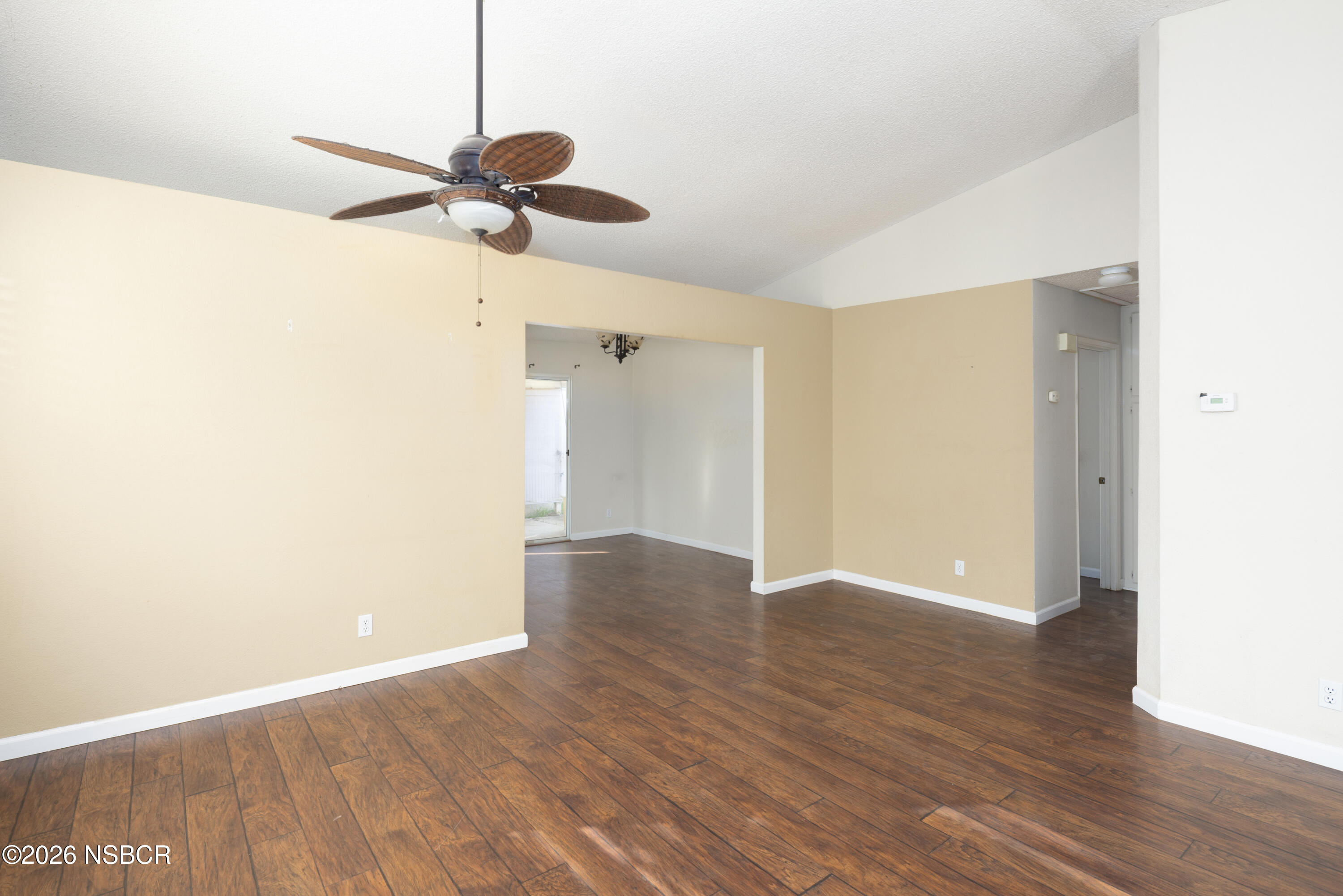 545 Santa Cruz Court Santa Maria, CA 93455 - Photo 7 of 28 a view of a room with wooden floor and a ceiling fan
