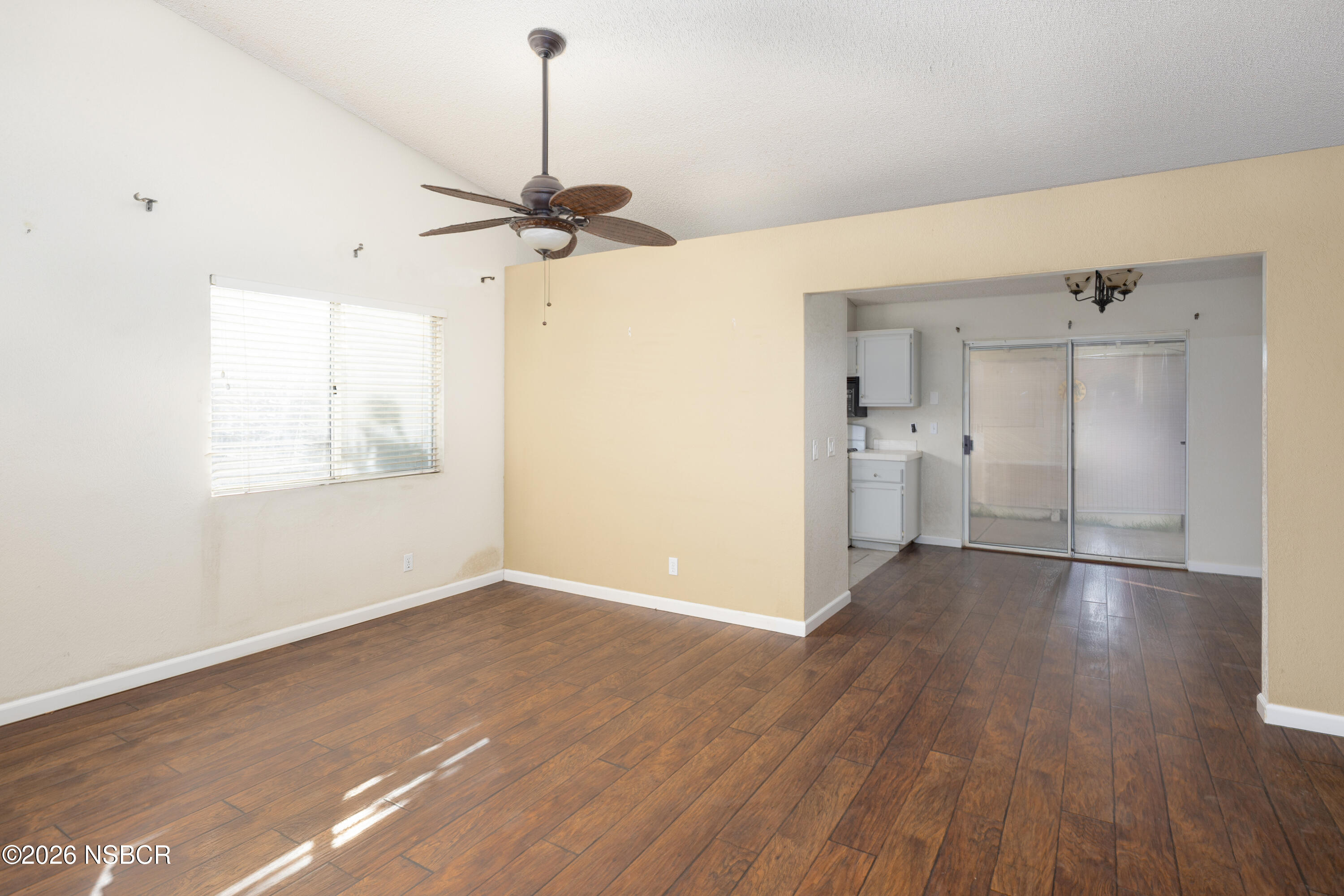 545 Santa Cruz Court Santa Maria, CA 93455 - Photo 8 of 28 a view of empty room with wooden floor and fan