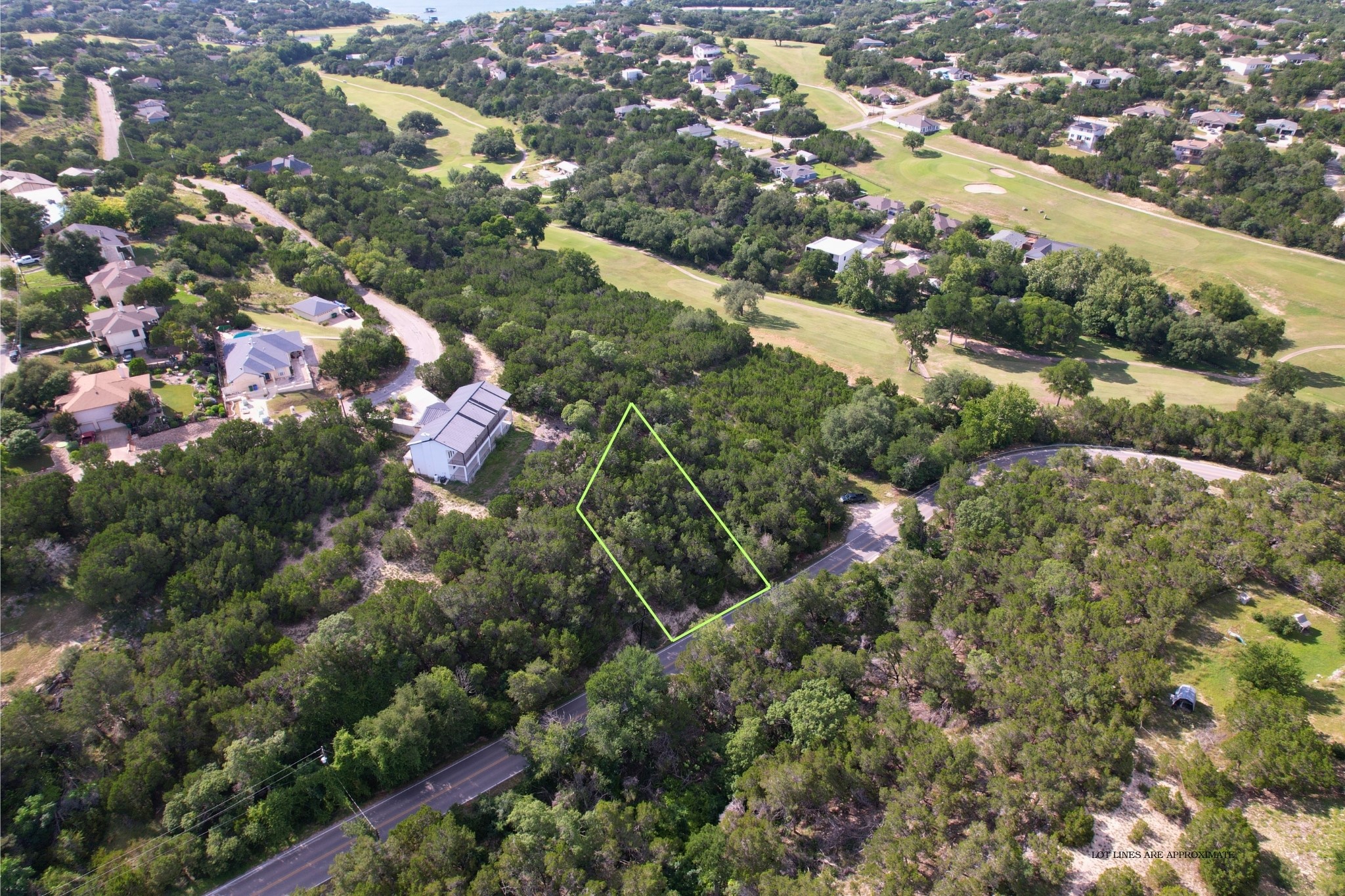 4500 Outpost Trace Leander, TX 78645 - Photo 2 of 13 A verdant aerial perspective reveals a prime lot nestled within a scenic, tree-filled landscape.