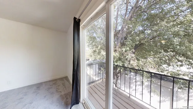 a view of a glass door with a balcony
