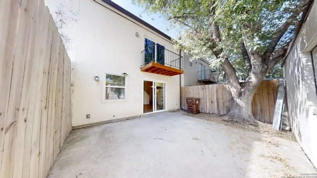 a view of a house with a yard and garage