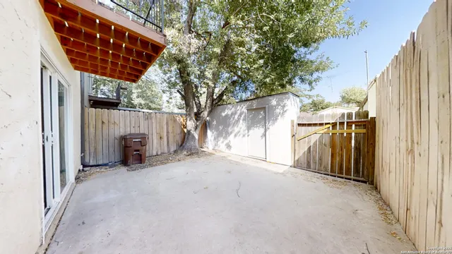 a view of a house with a backyard