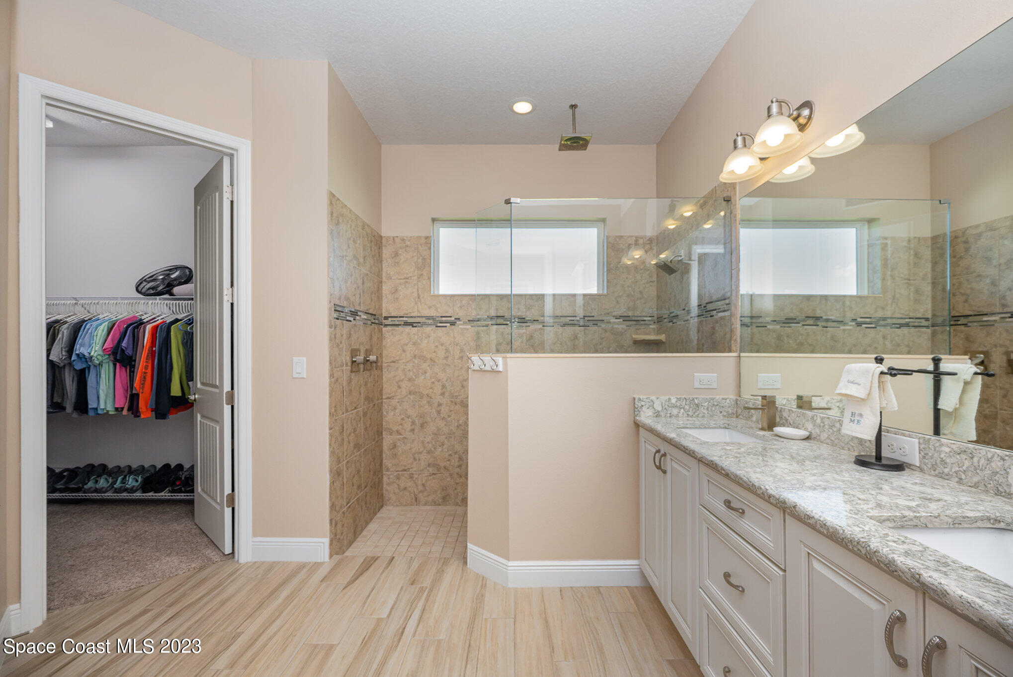 3850 Alamanda Key Drive Melbourne, FL 32901 - Photo 11 of 44 a bathroom with a sink and a mirror