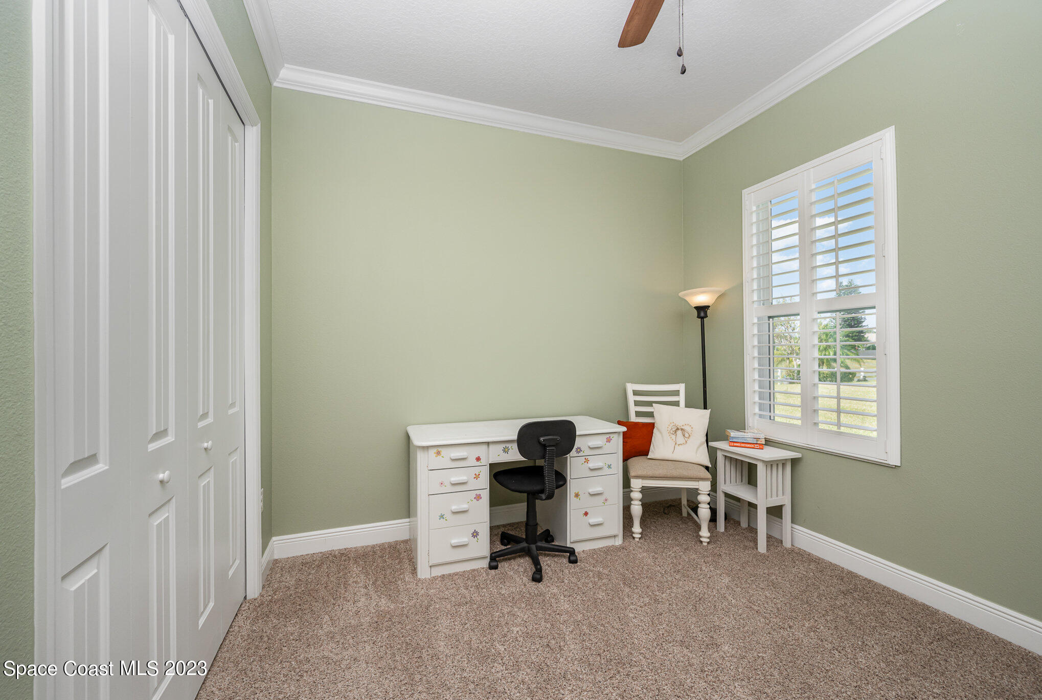 3850 Alamanda Key Drive Melbourne, FL 32901 - Photo 16 of 44 a view of a workspace with furniture and a window