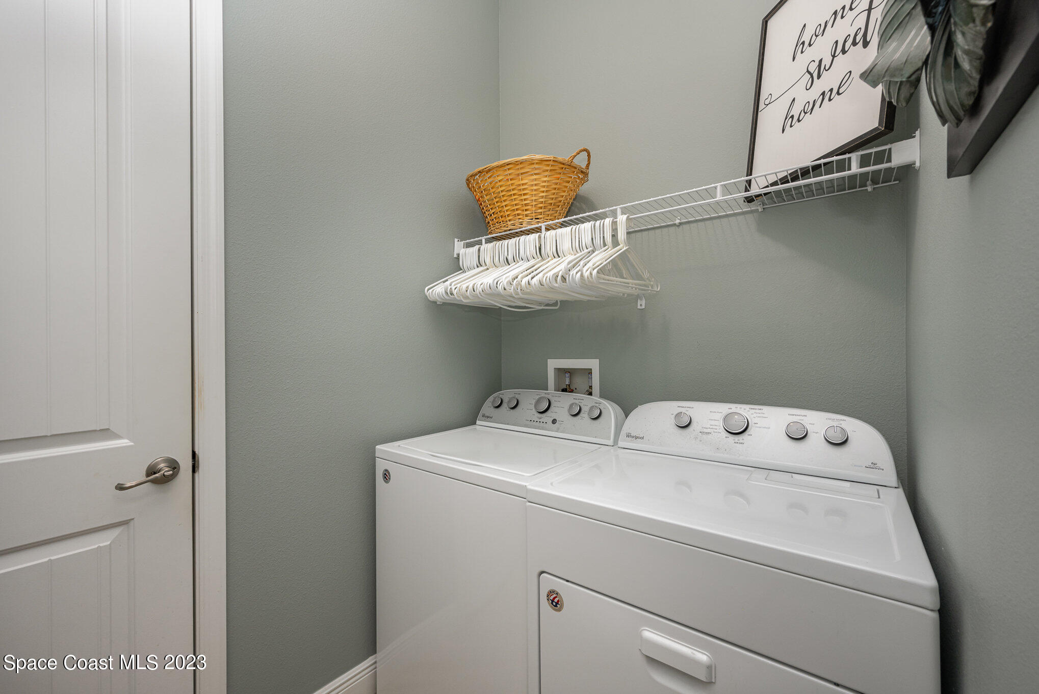 3850 Alamanda Key Drive Melbourne, FL 32901 - Photo 18 of 44 a utility room with dryer and washer