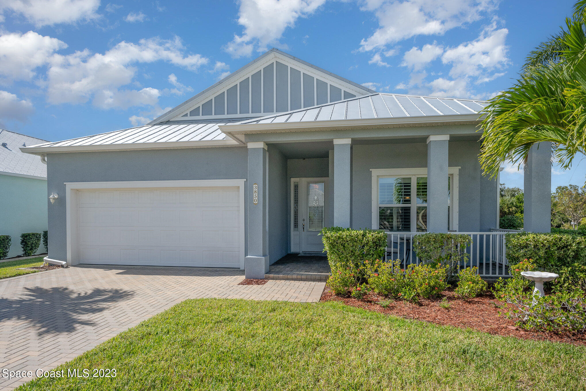 3850 Alamanda Key Drive Melbourne, FL 32901 - Photo 19 of 44 a front view of a house with a yard