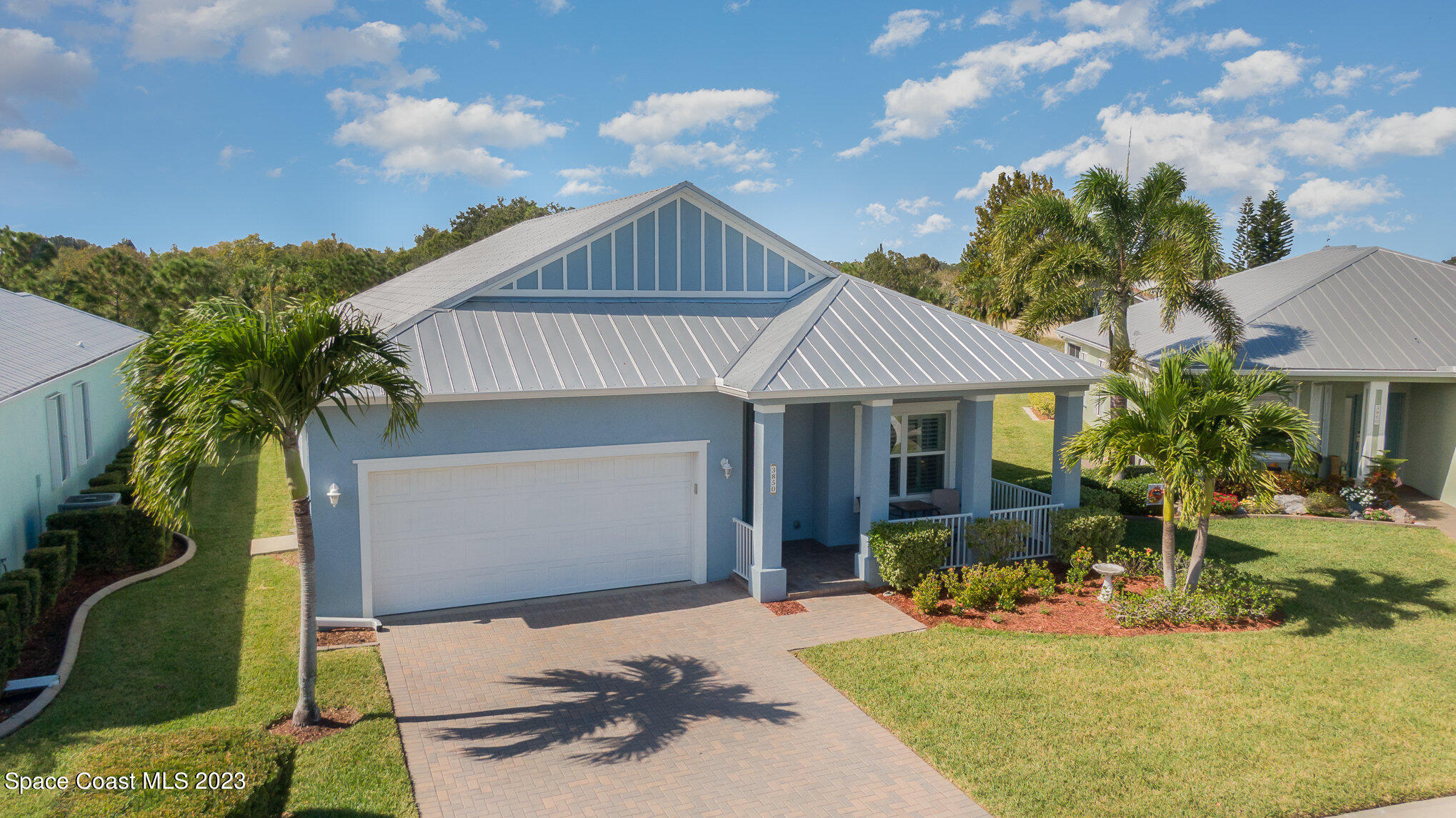 3850 Alamanda Key Drive Melbourne, FL 32901 - Photo 21 of 44 a front view of a house with garden