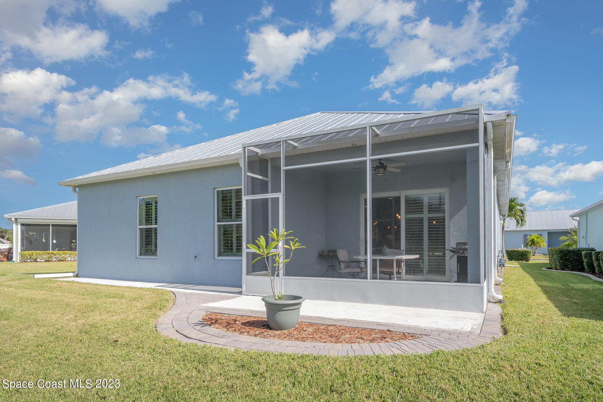 3850 Alamanda Key Drive Melbourne, FL 32901 - Photo 23 of 44 a front view of a house with garden