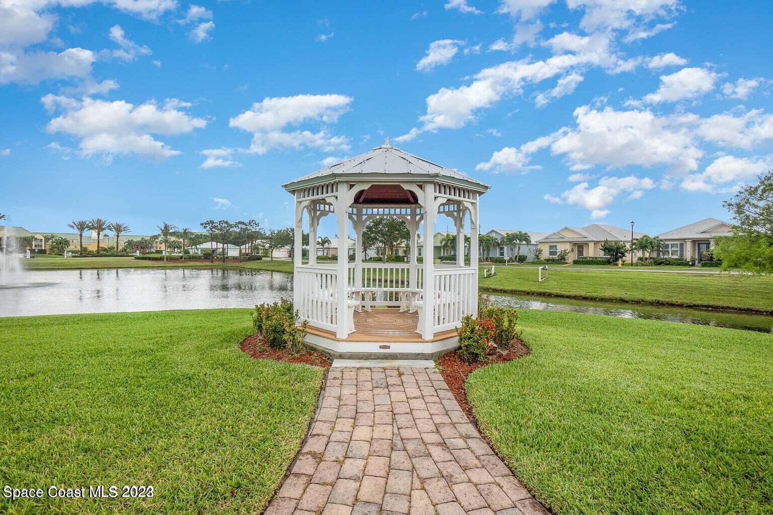 3850 Alamanda Key Drive Melbourne, FL 32901 - Photo 26 of 44 a view of a lake with a garden