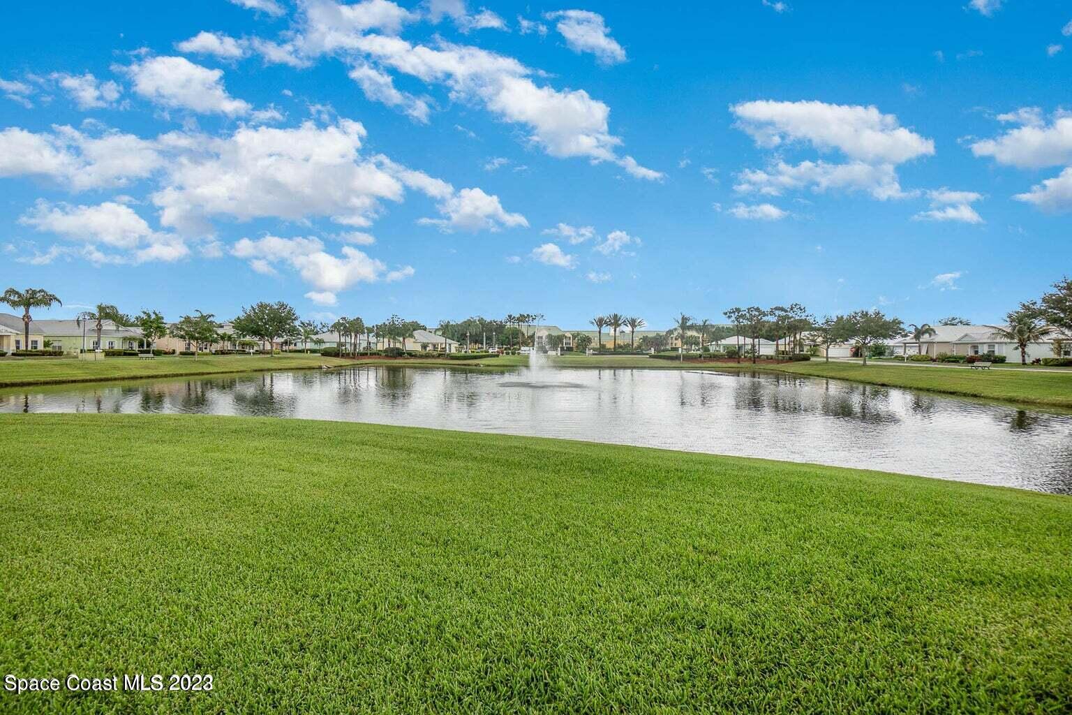 3850 Alamanda Key Drive Melbourne, FL 32901 - Photo 28 of 44 a view of a lake with houses in the back