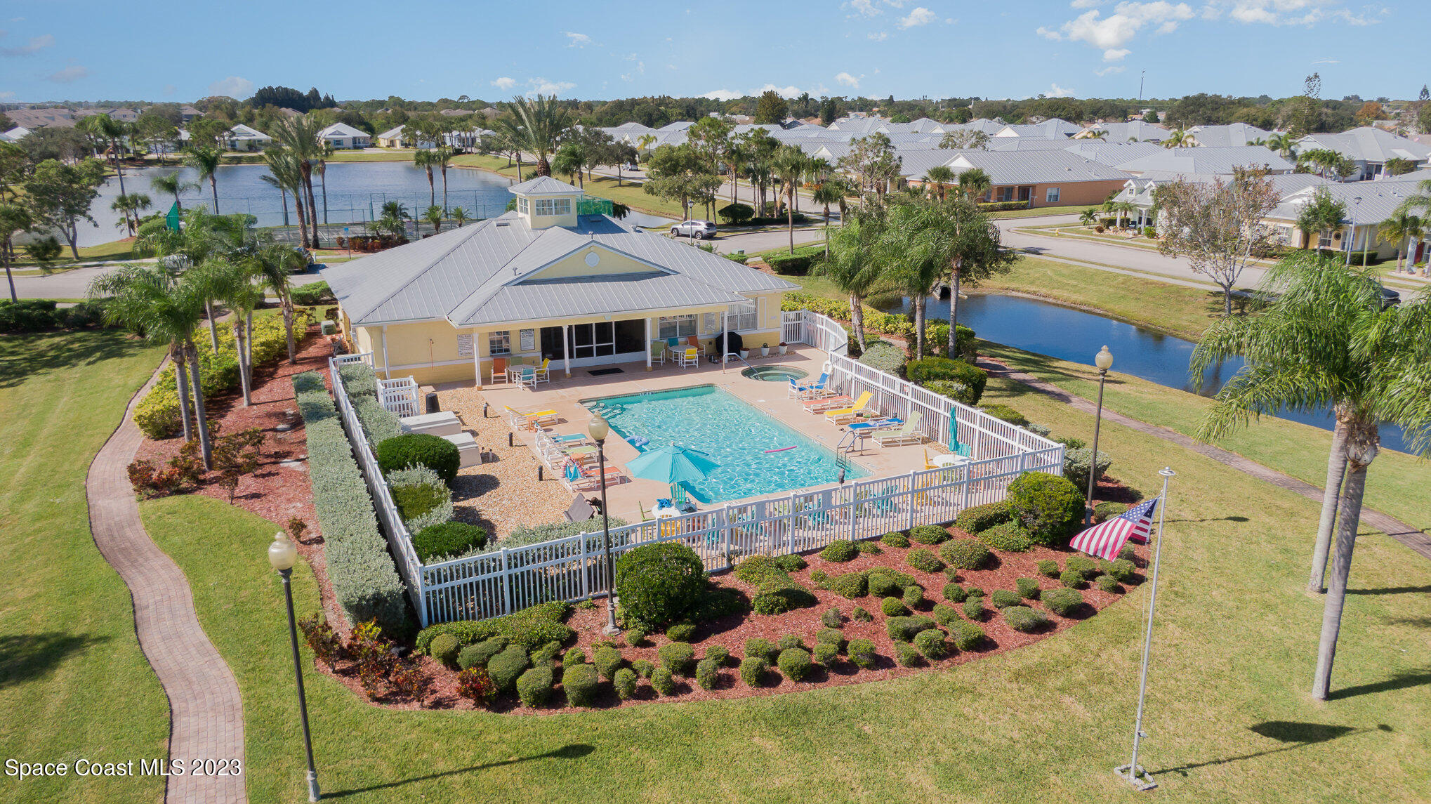 3850 Alamanda Key Drive Melbourne, FL 32901 - Photo 30 of 44 an aerial view of a house with a garden and lake view
