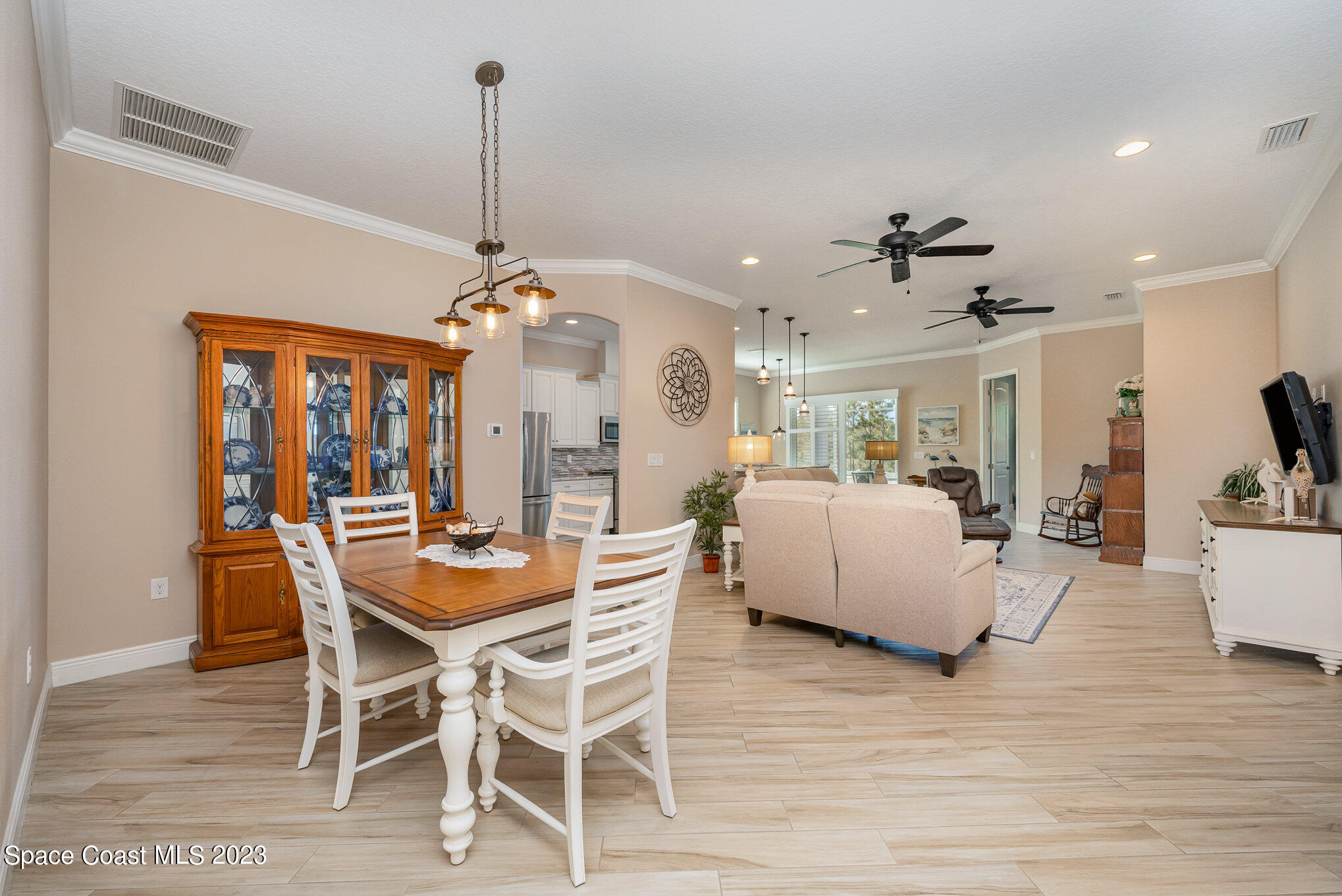 3850 Alamanda Key Drive Melbourne, FL 32901 - Photo 3 of 44 a view of a dining room with furniture window and wooden floor