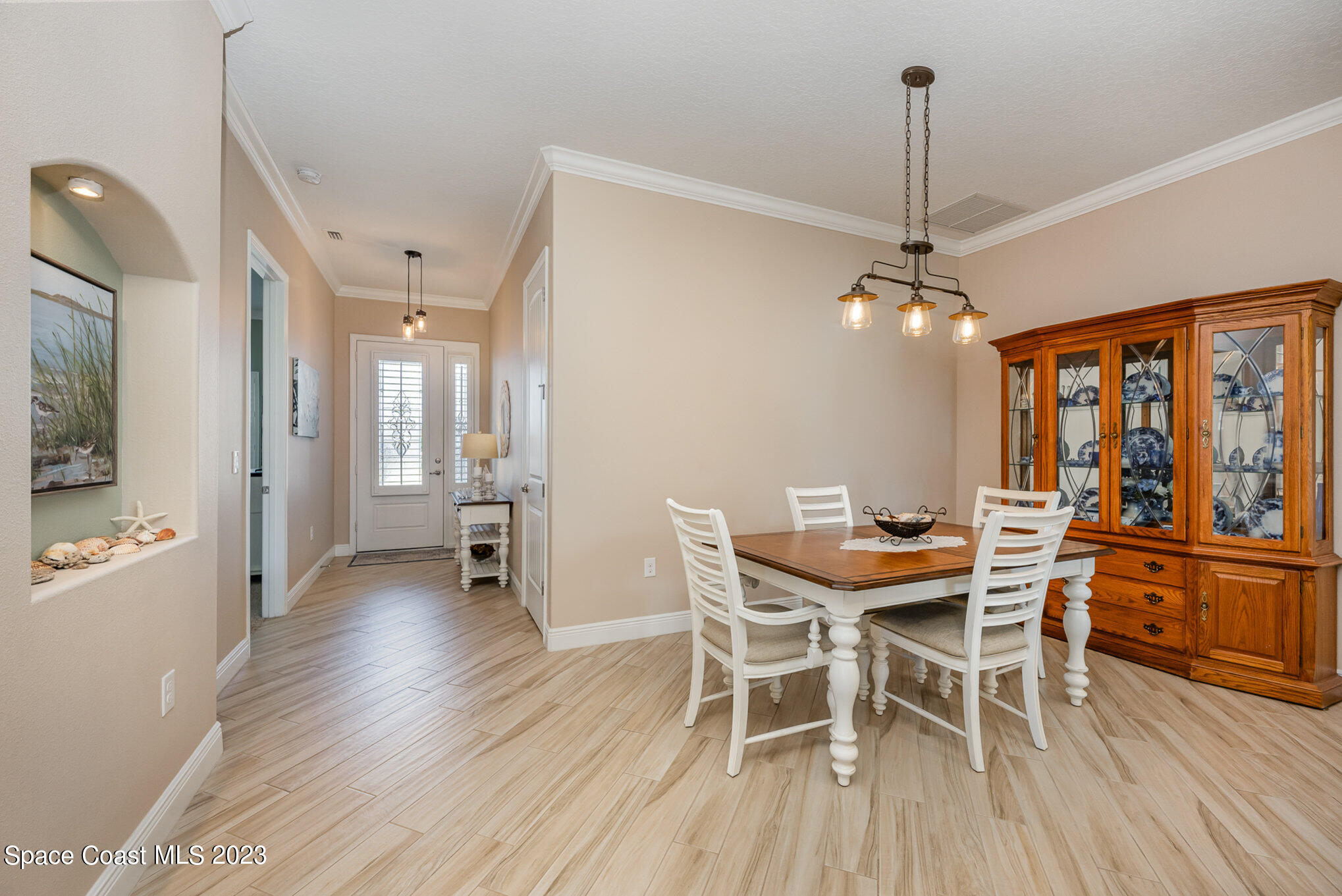 3850 Alamanda Key Drive Melbourne, FL 32901 - Photo 4 of 44 a view of a dining room with furniture window and wooden floor
