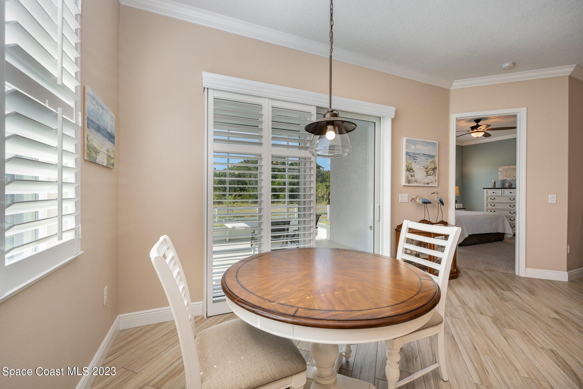 3850 Alamanda Key Drive Melbourne, FL 32901 - Photo 7 of 44 a view of a dining room with furniture window and wooden floor