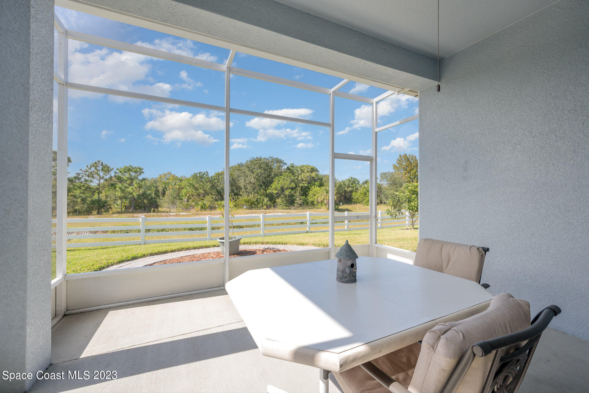 3850 Alamanda Key Drive Melbourne, FL 32901 - Photo 8 of 44 a view of a dining room and kitchen with a large window