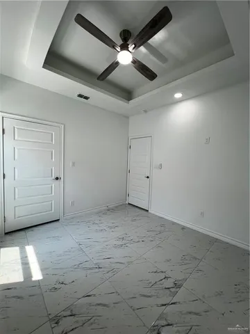 an empty room with fan
