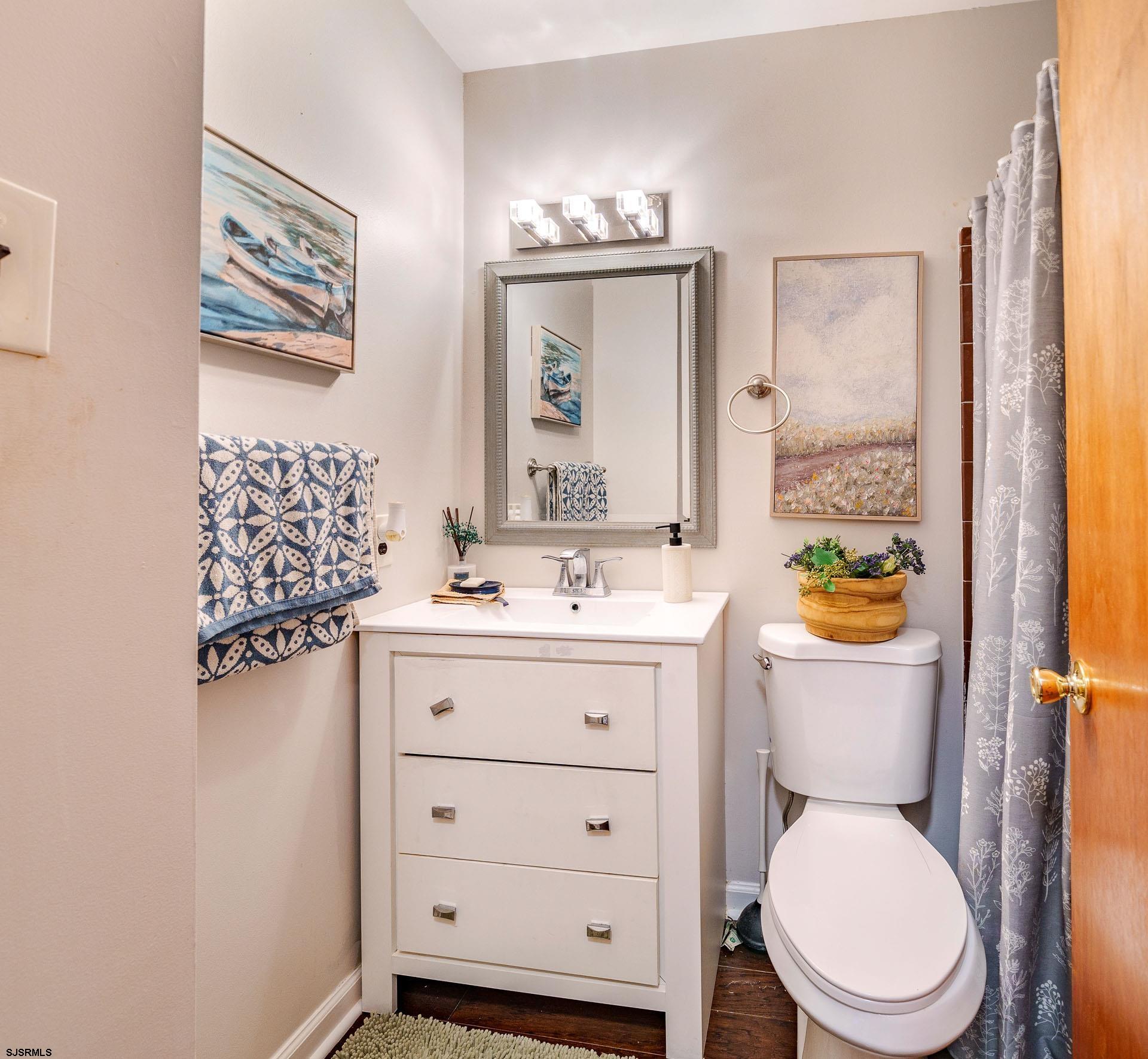 68 Defeo Lane Somers Point, NJ 08244 - Photo 13 of 51 a bathroom with a granite countertop toilet sink and mirror