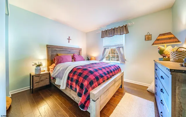 a bed room with a bed and a night stand