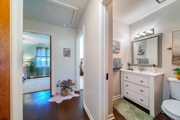 a bathroom with a sink mirror and vanity