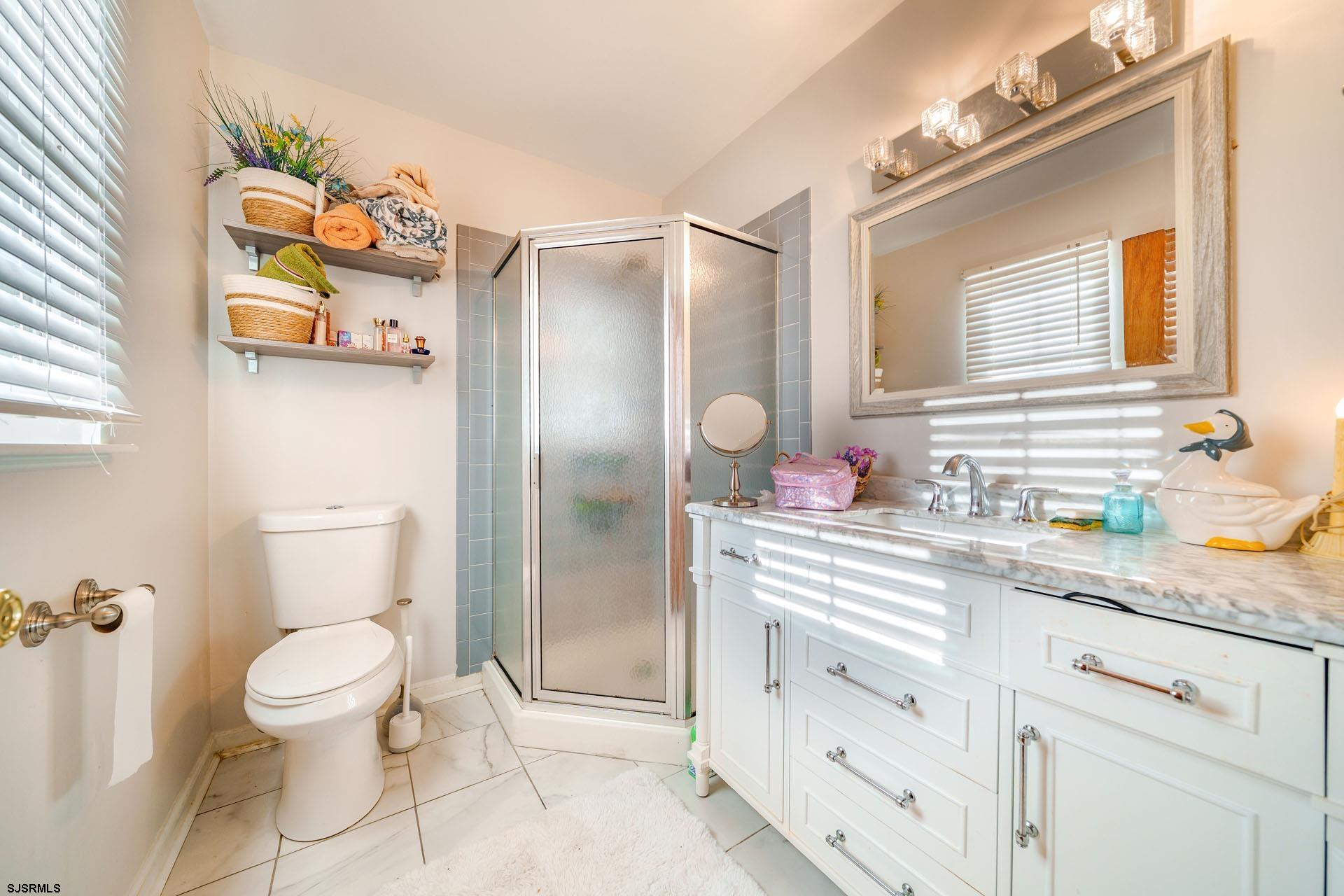 68 Defeo Lane Somers Point, NJ 08244 - Photo 19 of 51 a bathroom with a sink a vanity and a toilet