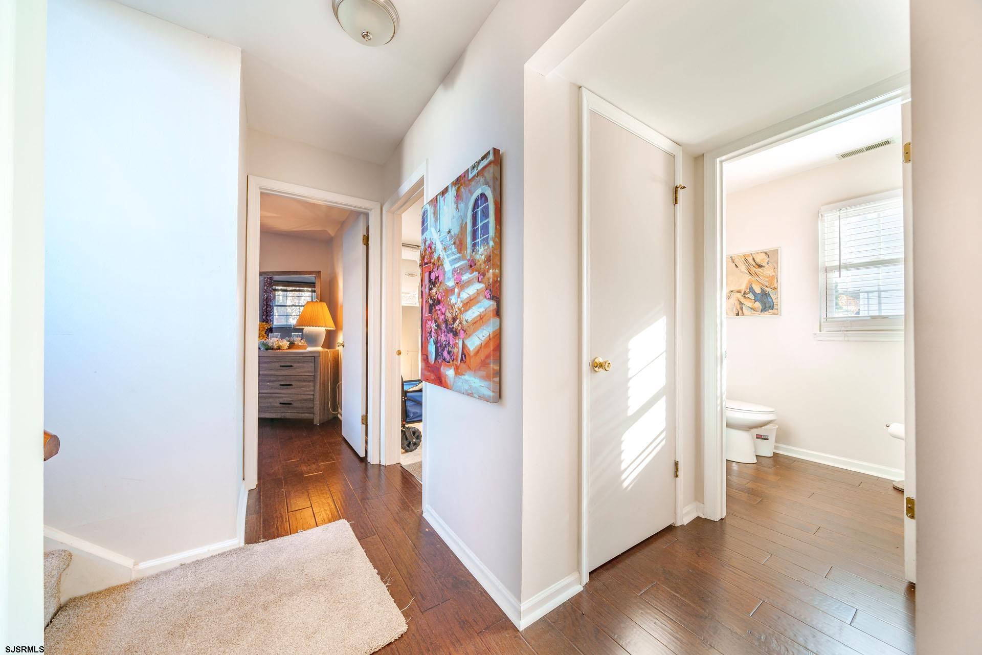 68 Defeo Lane Somers Point, NJ 08244 - Photo 20 of 51 a view of a hallway with bathroom and wooden floor