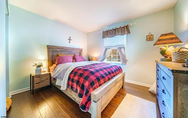 a bed room with a bed and a night stand