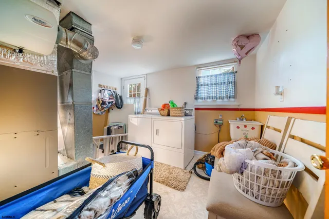 a bedroom with furniture and a wooden floor