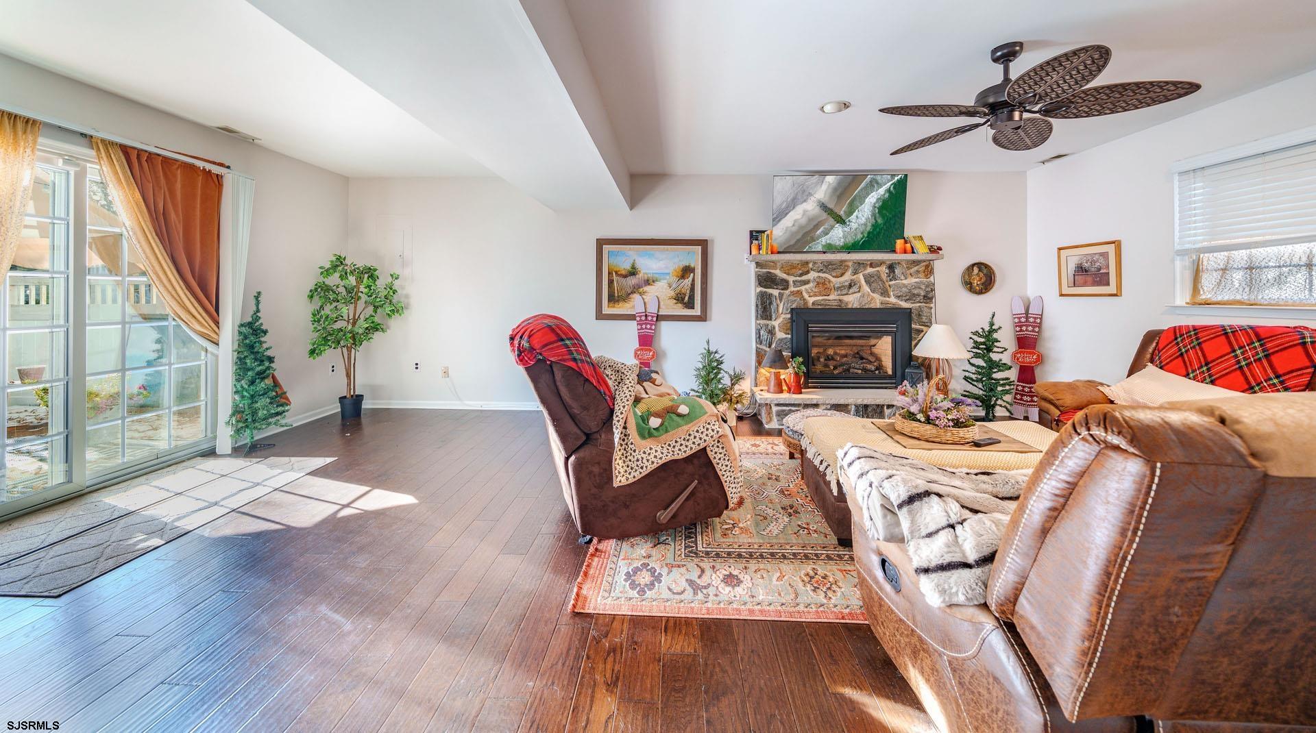 68 Defeo Lane Somers Point, NJ 08244 - Photo 25 of 51 a living room with furniture fireplace and a large window