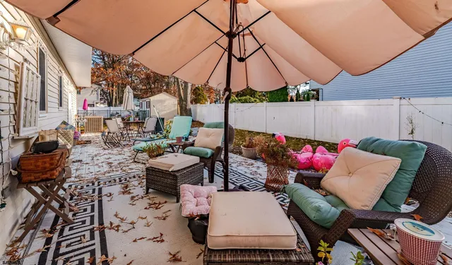 a view of an outdoor sitting area with furniture
