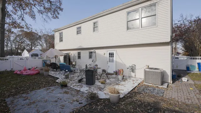 a front view of a house with sitting area